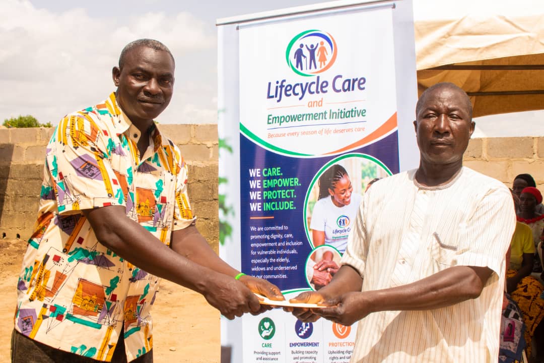 Lifecycle Care team presenting support to an elderly beneficiary